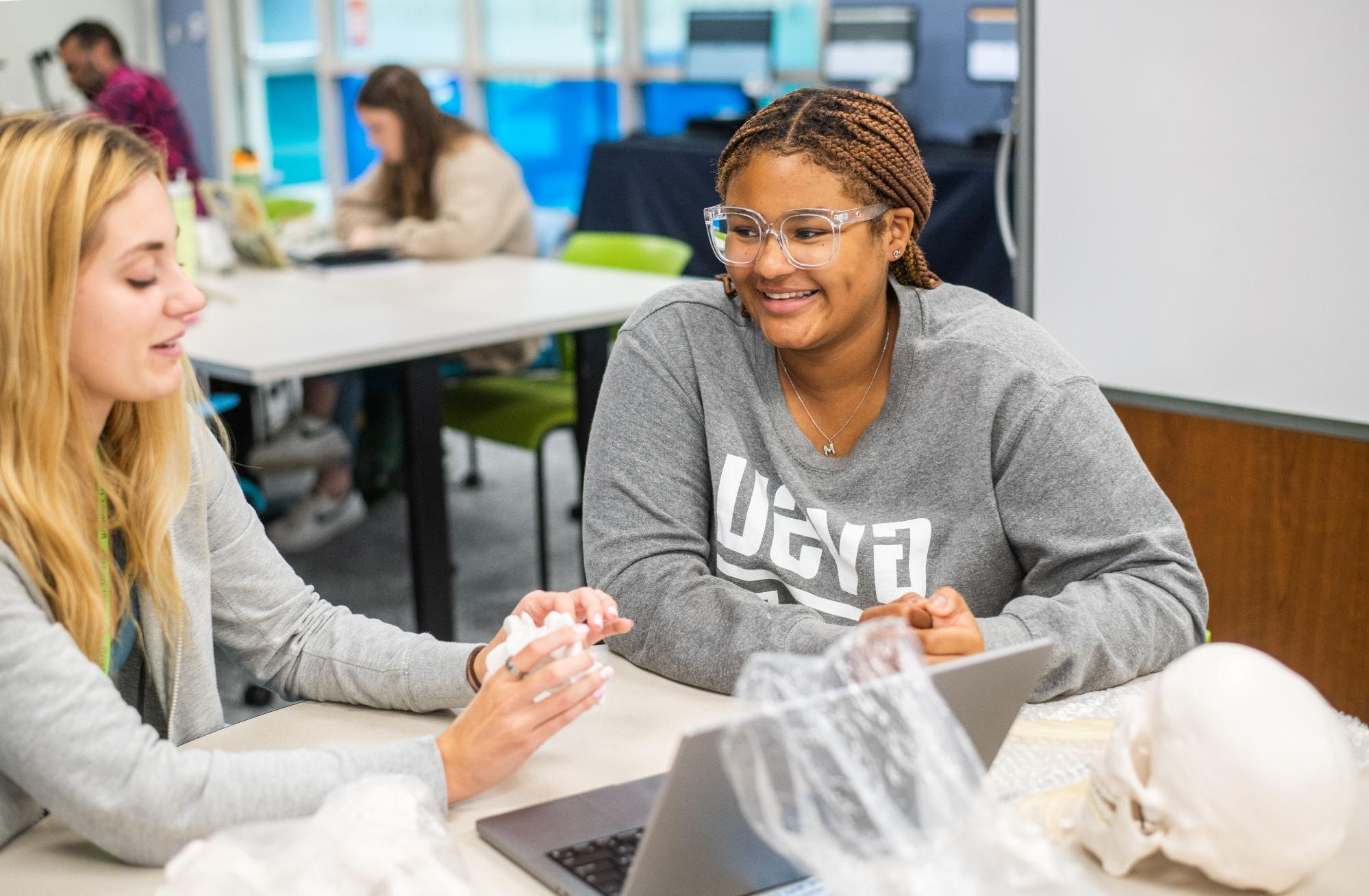 Smiling students studying